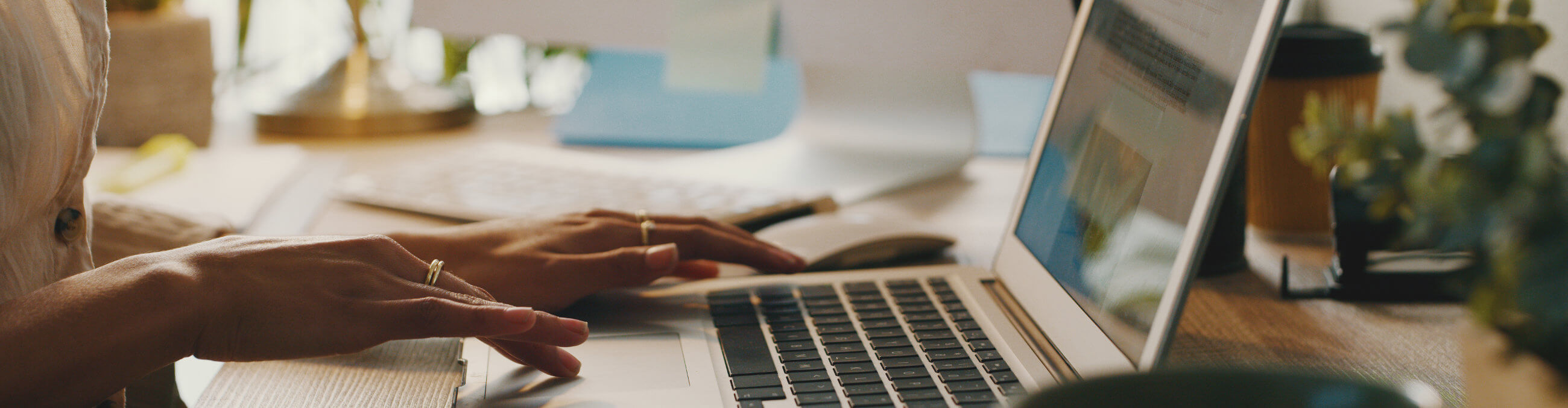 woman typing on a laptop